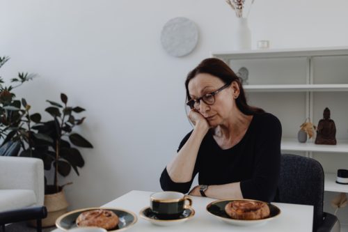 wrongful death woman sitting alone sad