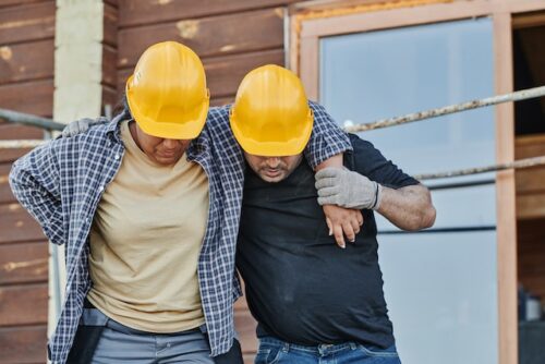 co-worker helping injured employee