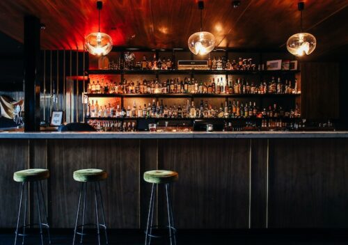 bar with bottles on wall