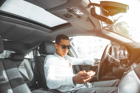 someone looking at their phone while driving