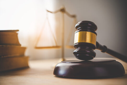 Law theme, mallet of the judge, law enforcement officers, evidence-based cases and documents taken into account..