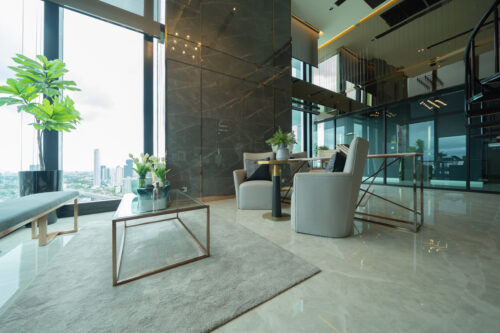 Inside of modern hotel lobby, entrance and reception, waiting area with urban city view of outdoor, indoor.
